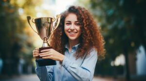 Do You Measure Up? How Conditions of Worth Impact Self-Worth 12 Cheerful student showcasing a won trophy