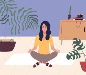 woman with closed eyes sitting cross legged on floor and meditating