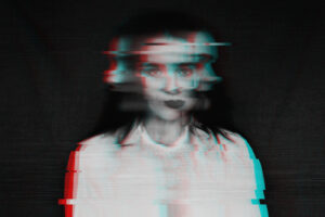 When Trauma Shapes the Mind’s Reality 24 black and white blurred abstract portrait of a girl with a glitch effect
