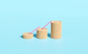 Social Mobility: Sociology, Types & Examples 28 stacks of gold coins increasing in number with ladders between them to show social mobility in terms of wealth